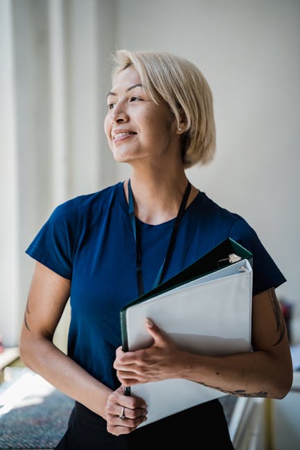 A cheerful office employee looking at the camera, embodying focus and well-being.
